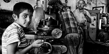 a boy working on a machine