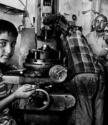 a boy working on a machine